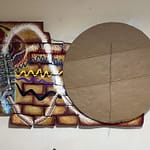 "Circular base with canvas pieces arranged around it, showing the structural foundation of the Samsaragammon game board in development."