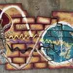 "Circular artwork with radiating spike-like patterns arranged in a crown formation, representing the starting point of an infinite symbol designed as part of the Samsaragammon game board."